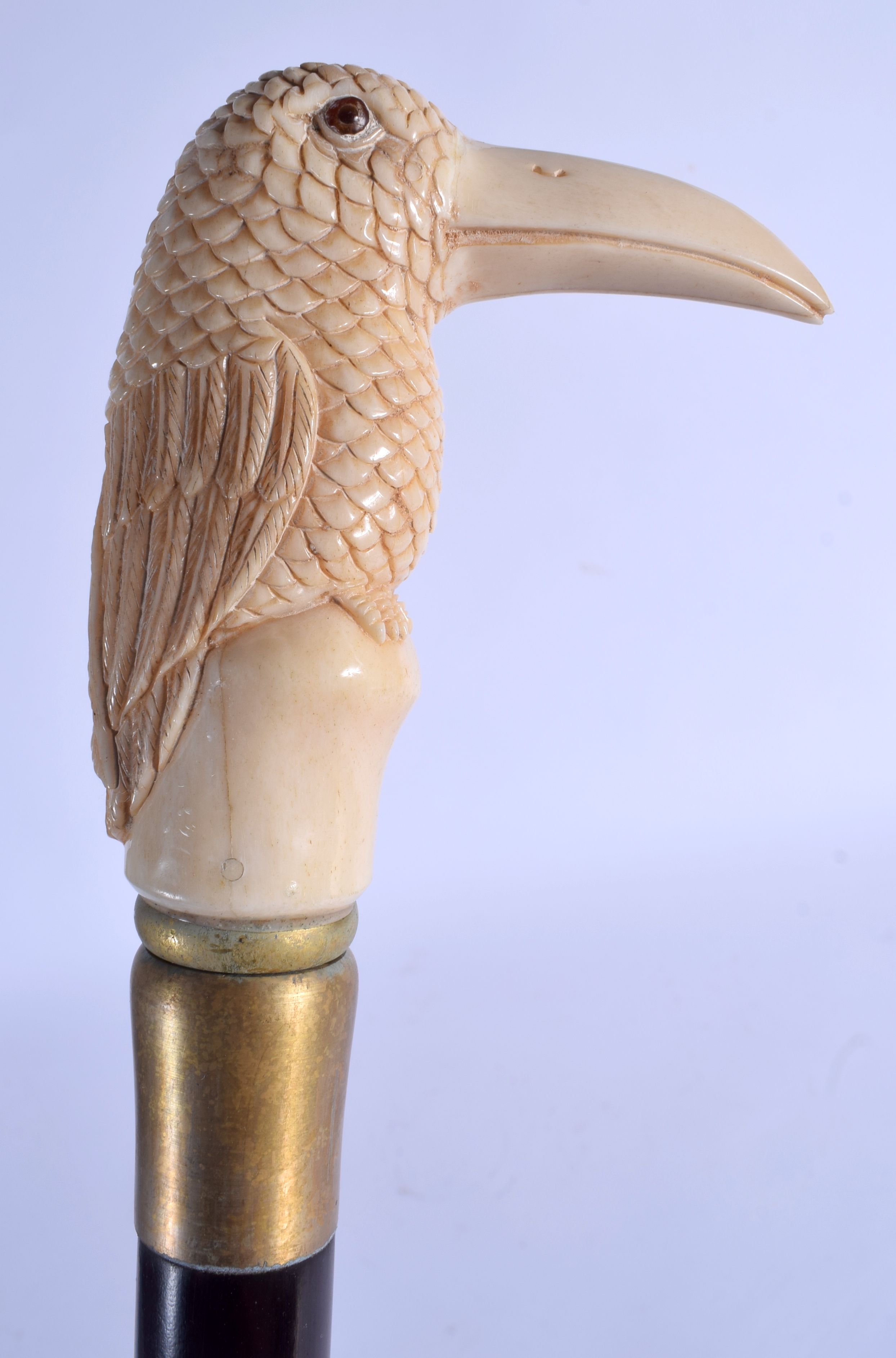 A NOVELTY BONE HANDLED CARVED WOOD WALKING CANE. 84 cm long.