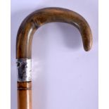 A 19TH CENTURY CONTINENTAL CARVED RHINOCEROS HORN HANDLED WALKING CANE. 88 cm long.