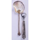 AN ITALIAN SILVER MOUNTED BOTTLE OPENER and an unusual moon head glass and pearl spoon. Largest 22 c