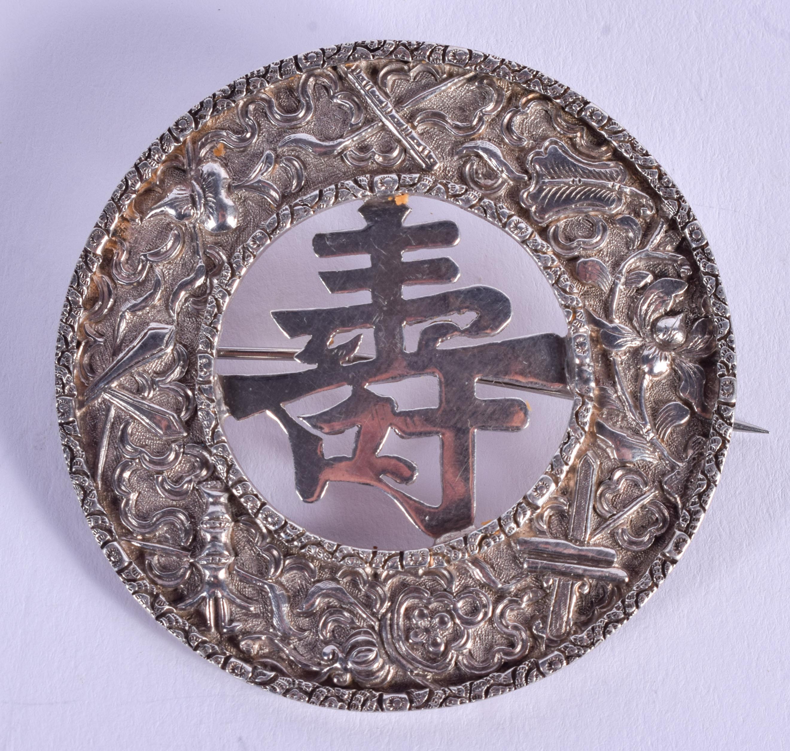 AN ANTIQUE CHINESE SILVER BROOCH. 25 grams. 6 cm diameter.