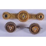 A MID VICTORIAN YELLOW METAL AND DIAMOND BROOCH with matching studs. 6 grams. (3)