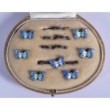 A CHARMING ART DECO SILVER AND ENAMEL BUTTERFLY BUTTON SET. 1 cm x 0.5 cm.