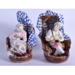 A PAIR OF 19TH CENTURY CONTINENTAL PORCELAIN FIGURES modelled as a male and female within chairs. 19