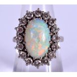 A VINTAGE 18CT WHITE GOLD OPAL AND DIAMOND RING. 8.2 grams. Opal 1.4 cm x 0.8 cm. M/N.