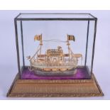 AN EARLY 20TH CENTURY CHINESE YELLOW & WHITE METAL BOAT within a fitted case. Boat 21 cm x 18 cm.
