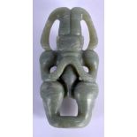 A CHINESE CARVED HONGSHAN CULTURE CARVED JADE FIGURE OF A SUN GOD possibly Neolithic period. 12 cm x