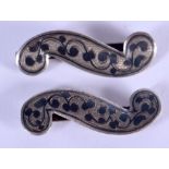 A PAIR OF ANTIQUE RUSSIAN NIELLO SILVER SLIDES. 6 grams. 4 cm wide.