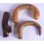 THREE 19TH CENTURY CARVED CONTINENTAL CARVED RHINOCEROS HORN WALKING CANE HANDLES. Largest 11 cm
