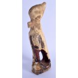 AN EARLY ANTIQUITY WOODEN FIGURE OF HORUS C2000BC of almost sculptural form. 27 cm high.