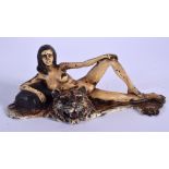 A CONTEMPORARY COLD PAINTED BRONZE NUDE LADY upon a tiger skin rug. 14 cm x 8 cm.