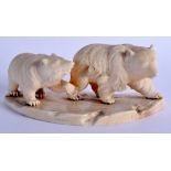 A 19TH CENTURY JAPANESE MEIJI PERIOD CARVED IVORY OKIMONO modelled as roaming bears. 14 cm x 6 cm.