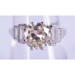 A FINE PLATINUM AND DIAMOND RING the central stone of approx 2.09 cts, encased within 0.8 cts of bag