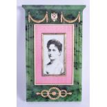 AN UNUSUAL LARGE CONTINENTAL SILVER GOLD AND ENAMEL JADE FRAME decorated with classical swags and mo
