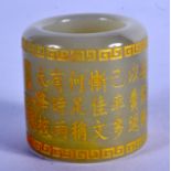A CHINESE CARVED JADE CALLIGRAPHY ARCHERS RING 20th Century. 3.25 cm wide.