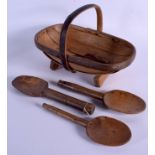 THREE FRUITWOOD DAIRY SPOONS and a basket. Largest 28 cm x 20 cm. (4)