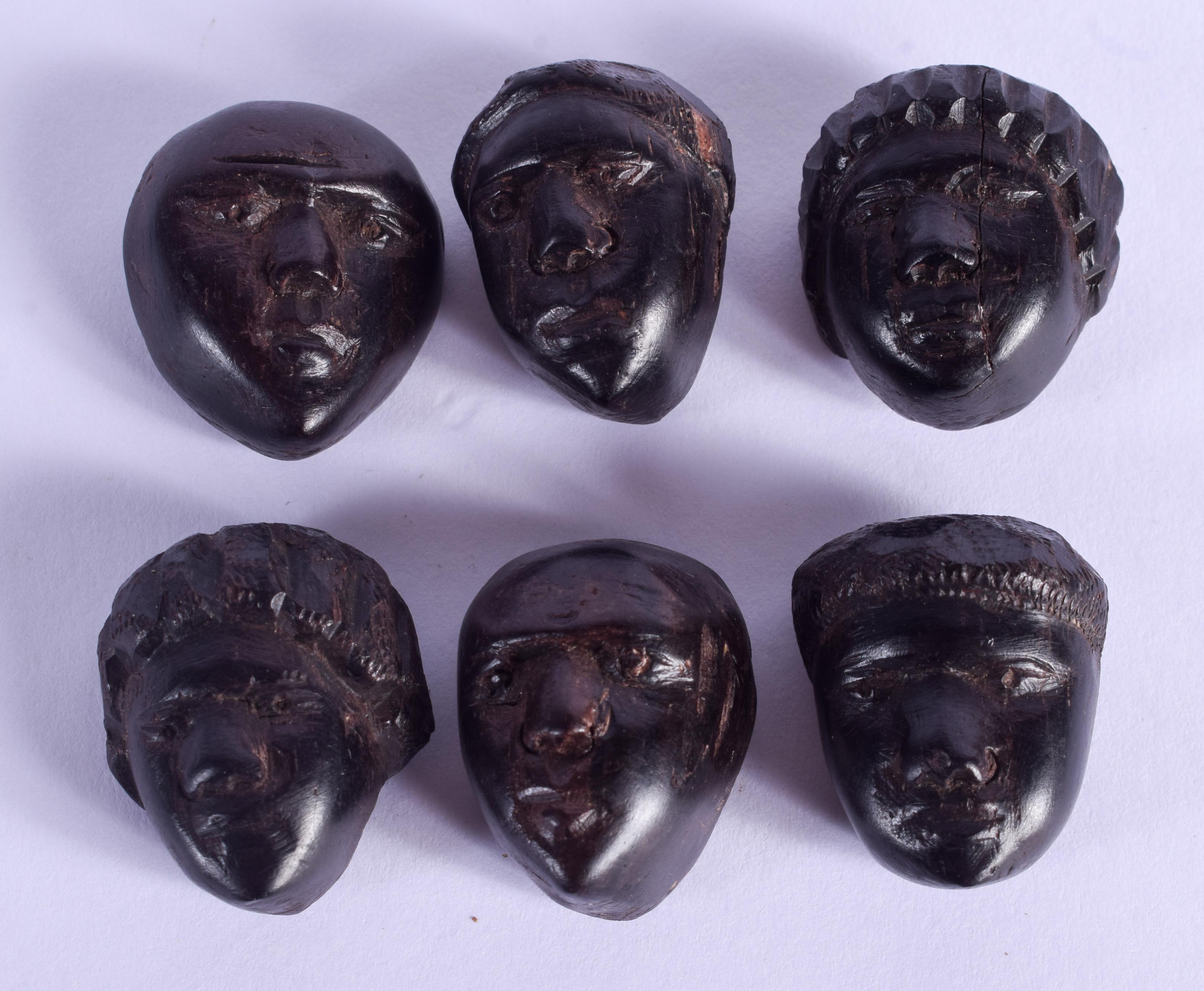 SIX UNUSUAL AFRICAN TRIBAL HEADS. 2 cm x 1 cm. (6)