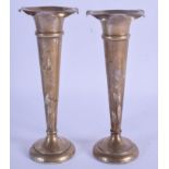 A PAIR OF ANTIQUE SILVER VASES. 387 grams loaded.