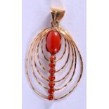 A 1970S YELLOW METAL AND CORAL PENDANT. 3.1 grams. 4.5 cm x 2.5 cm.