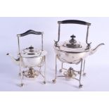 A NEAR PAIR OF ARTS AND CRAFTS SILVER PLATED SPIRIT TEAPOTS AND COVERS. Largest 34 cm x 22 cm.