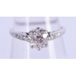 A VINTAGE GOLD AND DIAMOND SOLITAIRE RING of approx 0.6 cts. F/G. 2.1 grams.