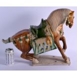 A LARGE 19TH CENTURY CHINESE SANCAI GLAZED POTTERY FIGURE OF A HORSE Tang Style, modelled upon a sha