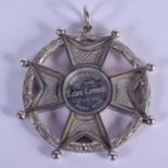 A LARGE 19TH CENTURY SCOTTISH WHITE METAL PENDANT gained by Mary Donaldson from the Madras Academy.