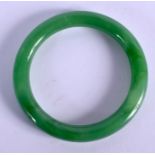 A 1930S CHINESE PEKING GLASS BANGLE. 6.75 cm diameter.