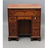 A GEORGIAN MAHOGANY KNEEHOLE DRESSING TABLE, late 18th century, the moulded edged top over a slide