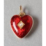 A LATE VICTORIAN HEART CHARM, the scarlet guilloche enamel fascia within black and white enamelled