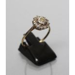 A DIAMOND RING, the central old brilliant cut stone of approximately 0.5cts claw set within a border