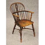 A WINDSOR ARMCHAIR, early/mid 19th century, in ash and elm, of low hoop backed form with shaped
