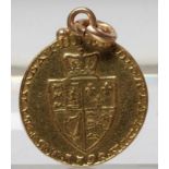 A GEORGE III GOLD SPADE HALF GUINEA, 1798, hard mounted as a pendant, 4.7g gross (Est. plus 17.5%