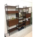 A TEAK LADDERAX WALL UNIT, 1960's, comprising a cupboard with sliding glass doors, two units with