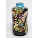 A MOORCROFT POTTERY WAXWINGS PATTERN VASE, 2011, of waisted cylindrical form, tubelined by Sandra