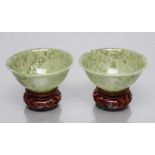 A PAIR OF TURNED AND POLISHED JADE BOWLS of plain circular form, 3 3/4" diameter, 1 1/2" high,
