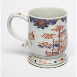 A CHINESE IMARI PORCELAIN MUG of baluster form on low domed foot with loop handle, painted in