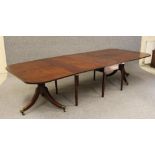A GEORGIAN MAHOGANY EXTENDING DINING TABLE, late 18th century, the rounded oblong top with drop leaf