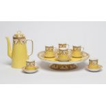 A ROYAL WORCESTER CHINA COFFEE SET, 1899, printed in sepia with ribbon tied swags of leaves