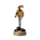 AFTER ROLAND PARIS - an Art Deco cold painted spelter figural bridge marker modelled as a jester