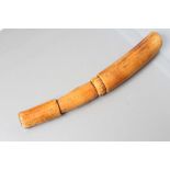 AN AFRICAN IVORY PESTLE, c.1900, with turned grip section, 16 1/4" long (Est. plus 21% premium