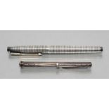 A STERLING SILVER COMBINATION PEN/KNIFE, maker Sampson Mordan & Co., the cylindrical case with