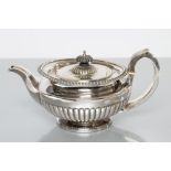 A GEORGE IV SILVER TEAPOT, maker William Bateman, London 1820, of compressed semi fluted globular