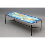 A METAL AND TEAK COFFEE TABLE, mid 20th century, of rounded oblong form, the wooden top painted in