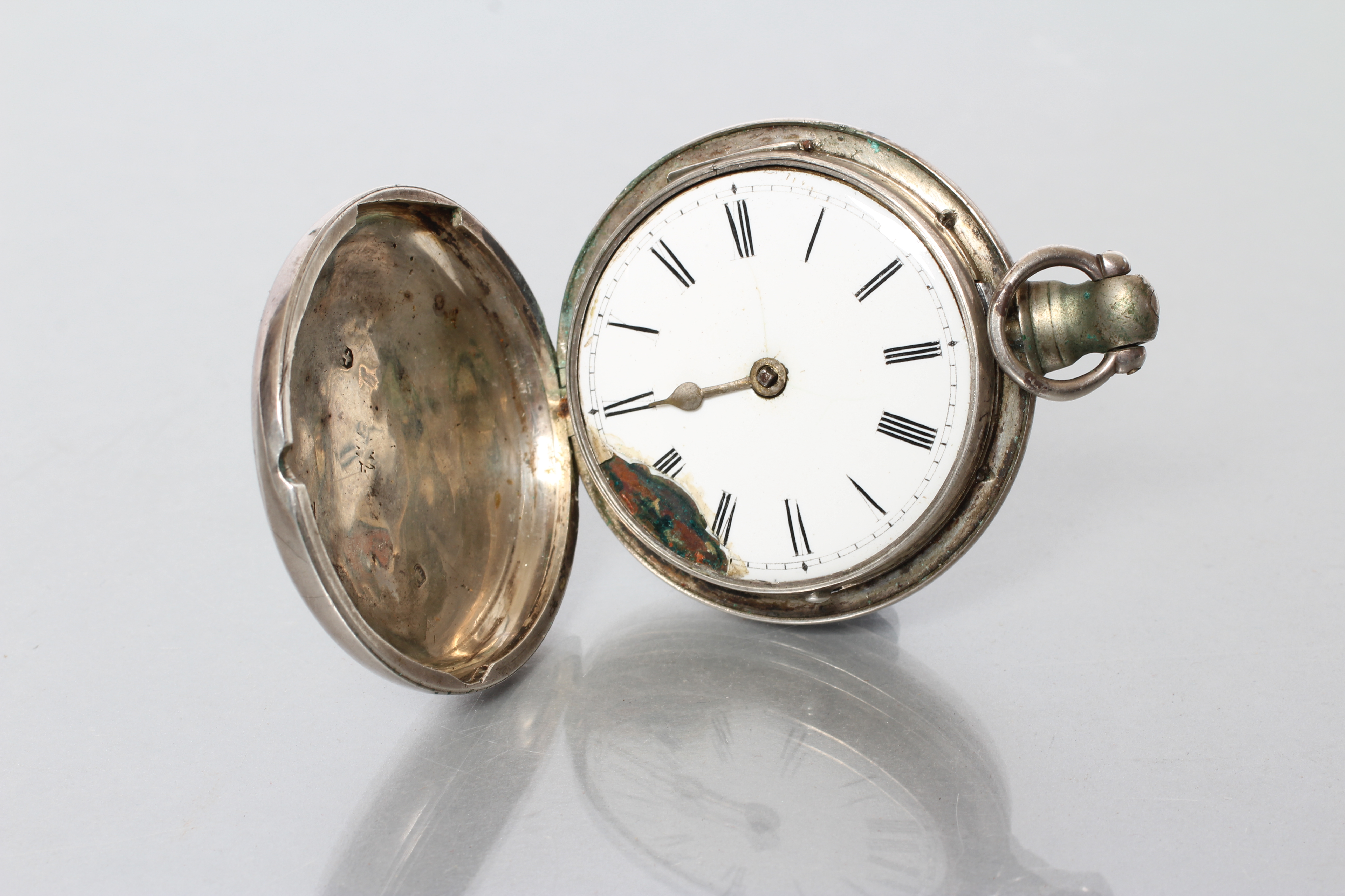 A LATE GEORGE III SILVER POCKET WATCH, the white enamel dial with black Roman numerals, the verge