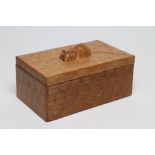 A ROBERT THOMPSON ADZED OAK TRINKET BOX of oblong form, the lift-off lid with carved mouse trademark