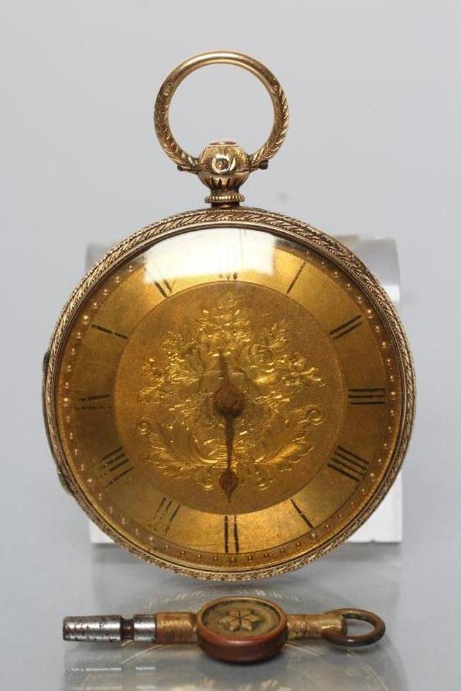 A VICTORIAN 18CT GOLD KEY WIND POCKET WATCH, the engine turned chapter ring with black Roman
