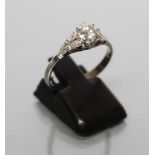 A DIAMOND RING, the brilliant cut stone of approximately 0.70cts, claw set to open triangular