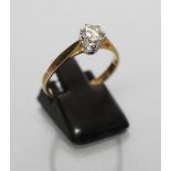 A SOLITAIRE DIAMOND RING, the brilliant cut stone of approximately 0.5cts claw set to a plain 18ct