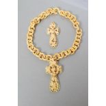 A VICTORIAN IVORY CROSS PENDANT of open form, extensively carved with lily of the valley and other