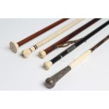 A COLLECTION OF FIVE REGENCY AND LATER WALKING CANES comprising rosewood (?) with eyelets and